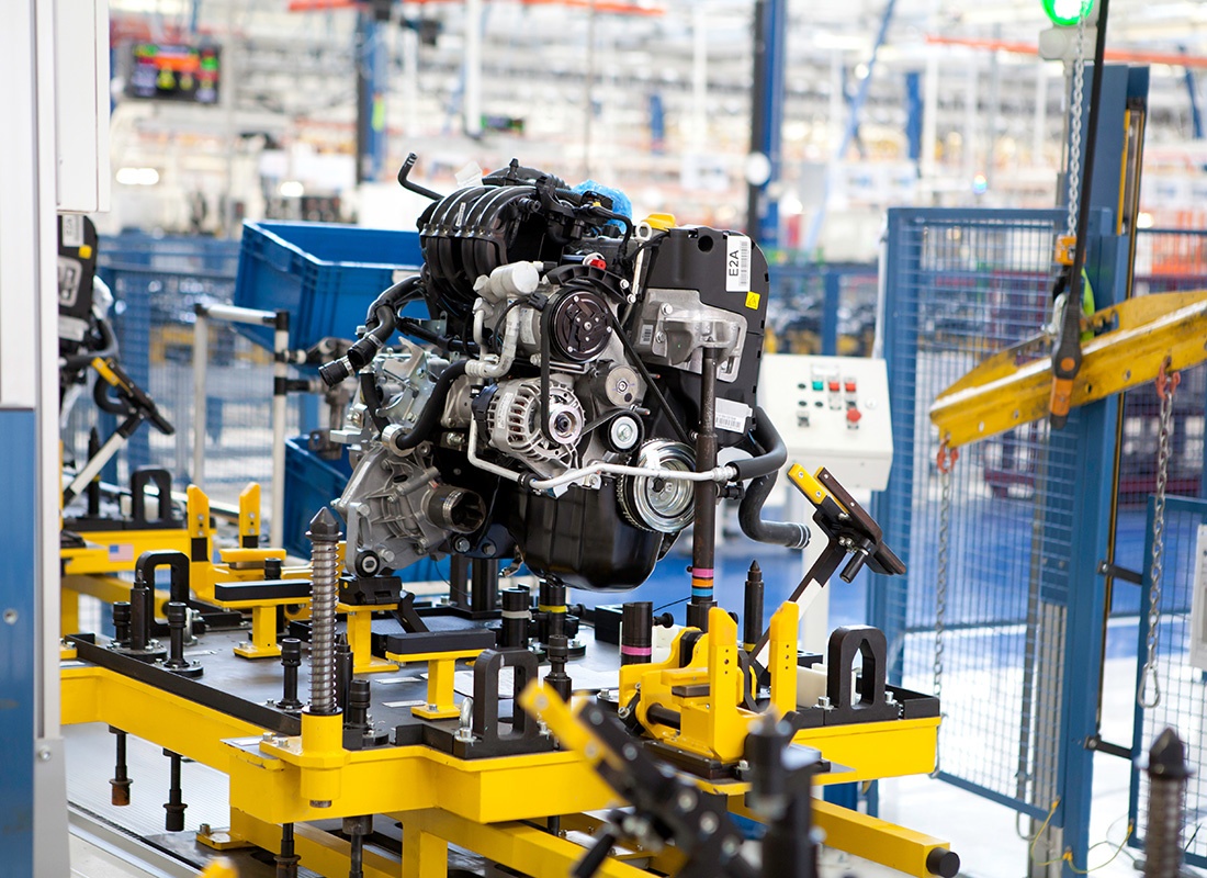 Insurance by Industry - Car Engine Assembled on the Factory Production Line